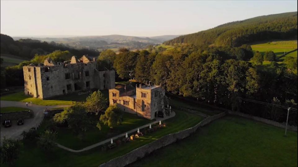 Barden Tower and Wharfedale Valley at sunset. 